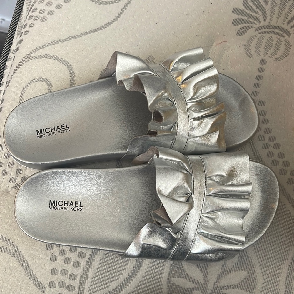 Brand new Michael Kors slides . Silver